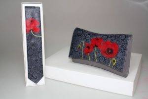 The Red Poppy in front of Black Tapestry